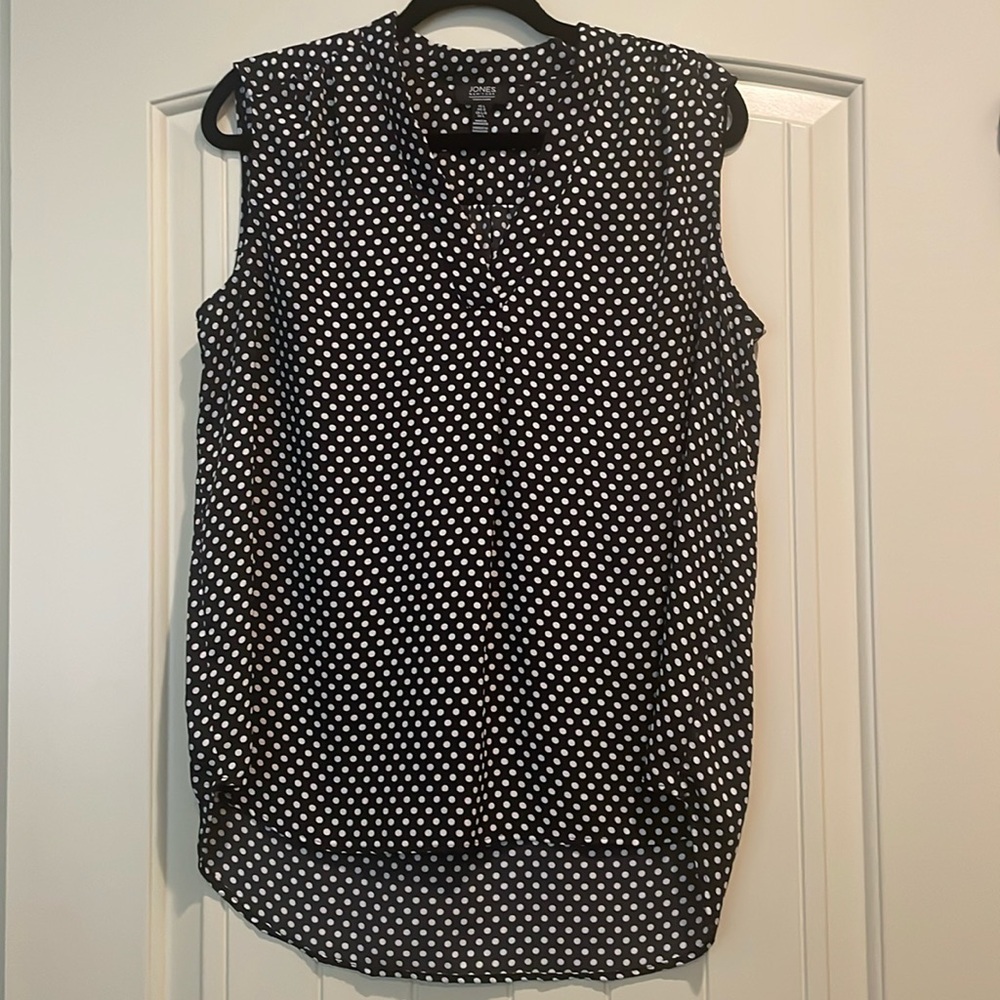 Adorable black and white polka dotted sleeveless shirt.